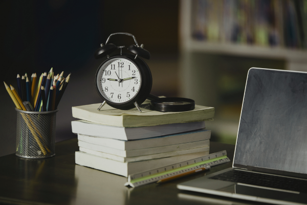 Books and laptop representing education resources